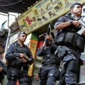 Brazilian BOPE police elite unit personnel patrol during an operation at Rocinha shantytown in Rio de Janeiro, Brazil on April 12, 2013.  AFP PHOTO/VANDERLEI ALMEIDA        (Photo credit should read VANDERLEI ALMEIDA/AFP/Getty Images)