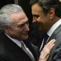 President Michel Temer (L) speaks with senator Aecio Neves before taking office before the plenary of the Brazilian Senate in Brasilia, on August 31, 2016. 
Brazil's Dilma Rousseff was stripped of the country's presidency in an impeachment vote Wednesday and replaced by her bitter rival Michel Temer, shifting Latin America's biggest economy sharply to the right. / AFP PHOTO / ANDRESSA ANHOLETE        (Photo credit should read ANDRESSA ANHOLETE/AFP/Getty Images)