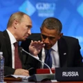 U.S. President Barack Obama, right, listens to Russia's President Vladimir Putin before the opening of the first plenary session of the G-20 Summit in Los Cabos, Mexico, Monday, June 18, 2012. (AP Photo/Andres Leighton)