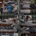 Patients affected by the COVID-19 coronavirus are treated at a field hospital set up at a sports gym, in Santo Andre, Sao Paulo state, Brazil, on May 11, 2020.