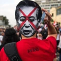 Demonstrators march during a protest against the pardon granted by Peruvian President Pedro Pablo Kuczynski to former President Alberto Fujimori, in Lima, on January 11, 2018. 
