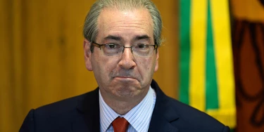 The president of the Brazilian Chamber of Deputies, Eduardo Cunha, gestures during breakfast with journalists in Brasília, on December 29, 2015. Cunha is a key figure in the impeachment process launched against President Dilma Rousseff.  AFP PHOTO / ANDRESSA ANHOLETE / AFP / Andressa Anholete        (Photo credit should read ANDRESSA ANHOLETE/AFP/Getty Images)