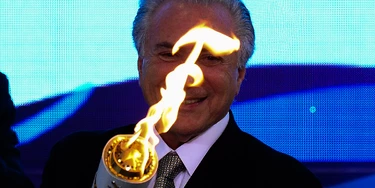 Brazilian acting President Michel Temer attends the reception ceremony of the Paralympic Torch at Planalto Palace in Brasilia, on August 25, 2016.
The Rio 2016 Paralympic Games will be held in Brazil from September 7 through 18. / AFP / ANDRESSA ANHOLETE        (Photo credit should read ANDRESSA ANHOLETE/AFP/Getty Images)