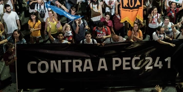 Opposers to President Michel Temer's economic recovery program, march against the constitutional amendment (PEC) 241, in Rio de Janeiro, Brazil, on October 17, 2016.Approved by Brazils lower house, the constitutional amendment limits budget increases to the rate of inflation for the next 20 years. Leftist lawmakers had fought against the spending cap, arguing that it would dramatically worsen conditions for ordinary Brazilians, especially the poor. / AFP / YASUYOSHI CHIBA (Photo credit should read YASUYOSHI CHIBA/AFP/Getty Images)