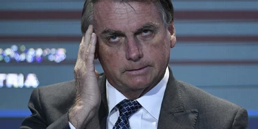 BRASILIA, BRAZIL - DECEMBER 07: President of Brazil Jair Bolsonaro gestures during a meeting with businessmen promoted by the National Confederation of Industry (CNI) on December 07, 2021 in Brasília, Brazil. (Photo by Mateus Bonomi/Getty Images)