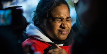 NEW YORK, NY - DECEMBER 11:  Erica Garner, daughter of Eric Garner, holds back tears while speaking to the media after leading a march of people protesting the Staten Island, New York grand jury's decision not to indict a police officer involved in the chokehold death of Eric Garner in July, on December 11, 2014 in the Staten Island Neighborhood of New York City. Protests have continued throughout the country since the Grand Jury's decision was announced last week.  (Photo by Andrew Burton/Getty Images)