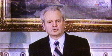 Yugoslav President Slobodan Milosevic delivers March 24 a nationwide television address. Milosevic said his government was right to reject foreign troops in Kosovo and urged Yugoslavs to stand firm against possible NATO air strikes.RS//ME - RTRN932