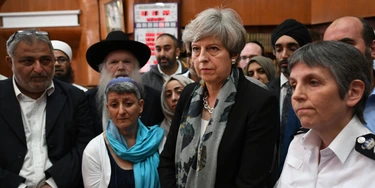 LONDON, ENGLAND - JUNE 19: British Prime Minister Theresa May and Metropolitan Police Commissioner Cressida Dick talk to faith leaders at Finsbury Park Mosque on June 19, 2017 in London, England.  Worshippers were struck by a hired van as they were leaving Finsbury Park mosque in North London after Ramadan prayers. One person was killed in the terror attack with a further 10 people injured.  (Photo by Stefan Rousseau/WPA Pool/Getty Images)