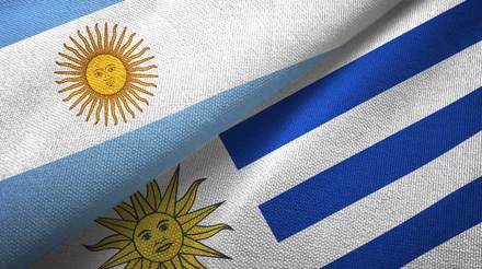 Uruguay and Argentina flags together textile cloth, fabric texture