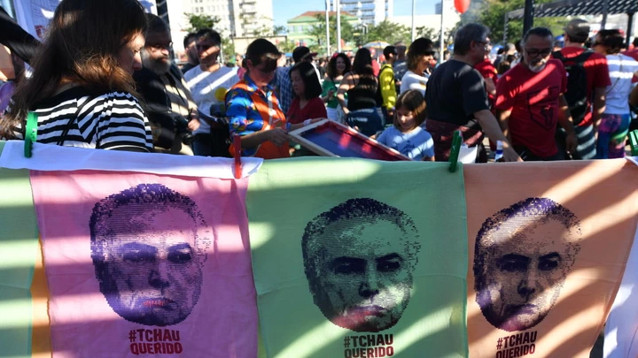 Demonstrators protest against labor and security reforms and the government of President Michel Temer in Sao Paulo Brazil on June 4, 2017. Brazil's Michel Temer may already be fighting a devastating corruption scandal, but this week he will face a more immediate threat: a court ruling on whether he should even be president. The Supreme Electoral Tribunal (TSE) case alleges that the reelection victory in 2014 of president Dilma Rousseff and her then vice president Temer was fatally tainted by illegal campaign funds and other irregularities and therefore should be annulled. / AFP PHOTO / NELSON ALMEIDA (Photo credit should read NELSON ALMEIDA/AFP/Getty Images)