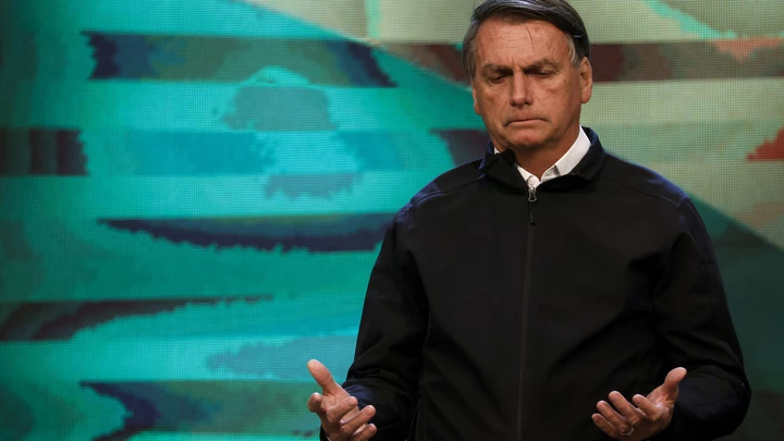 RIO DE JANEIRO, BRAZIL - SEPTEMBER 15: Jair Bolsonaro president of Brazil prays during the birthday worship of pastor Silas Malafaia (not in frame) at Assembleia de Deus Vitoria em Cristo Church on September 15, 2022 in Rio de Janeiro, Brazil. Evangelical community has been growing and represents around 30% of Brazilians. Both leading candidates, Lula and Bolsonaro, seek their votes in a very tight presidential election. (Photo by Wagner Meier/Getty Images)