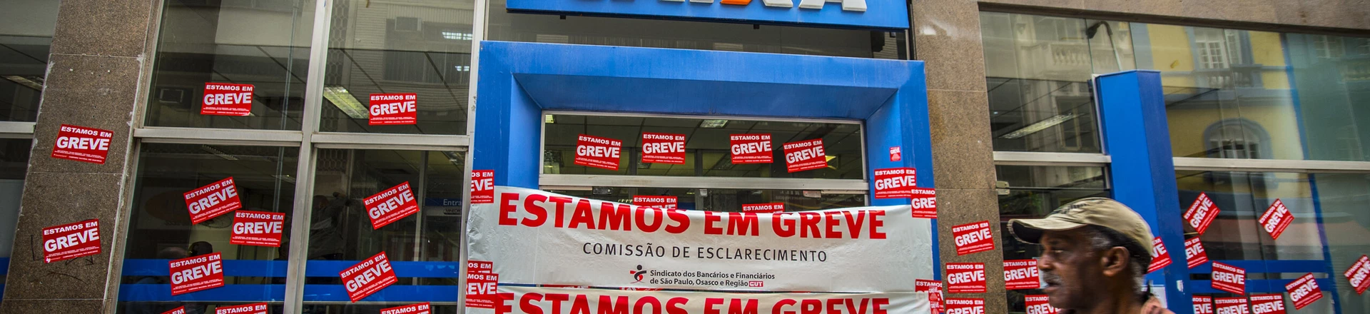 Posters placed in bank branch facade in Sao Paulo, Brazil, informing the strike of the category on September 6, 2016.More than 7,000 agencies stop throughout Brazil, bank went on indefinite strike from September 6.The first day of the strike of bank paralyzed the 7,359 operating branches across the country. The number is equivalent to 31.25% of total branches throughout Brazil, according to Central Bank data (Central Bank).Only in Sao Paulo, the movement ended the first day with a membership of more than 35,000 workers at 680 workplaces. (Photo by Cris Faga/NurPhoto via Getty Images)