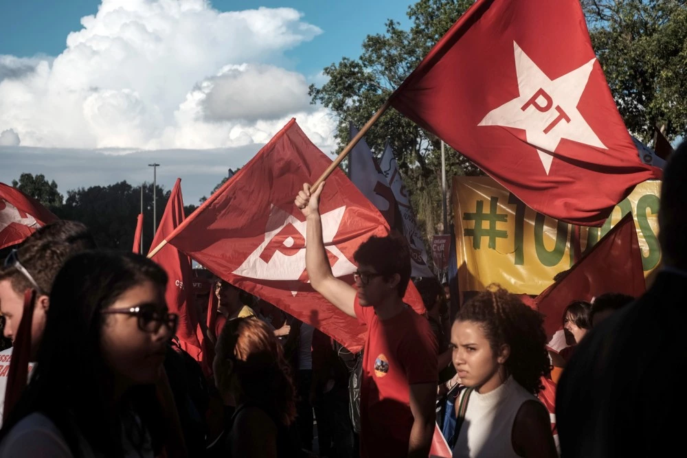 Workers' Party (PT) supporters demonstrate in support of President Dilma Rousseff and former President Luiz Inacio Lula da Silva in Rio de Janeiro, Brazil, on March 18, 2016. Brazilian President Dilma Rousseff's supporters took to the streets Friday to fight back at attempts to oust her, as a flurry of court battles raged over her controversial cabinet appointment of predecessor Luiz Inacio Lula da Silva. AFP PHOTO / YASUYOSHI CHIBA / AFP / YASUYOSHI CHIBA        (Photo credit should read YASUYOSHI CHIBA/AFP/Getty Images)