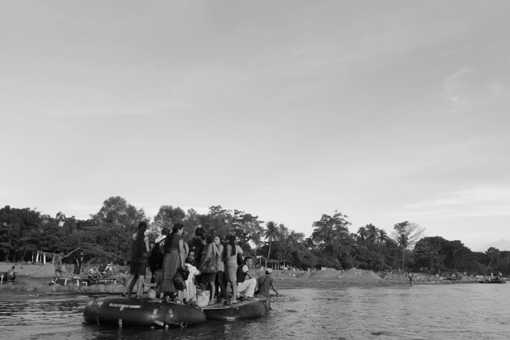 People illegally cross the Suchiate River that marks the Mexico/Guatemala border wishing sight of a bridge that holds an official crossing. There is little immigration enforcement and people cross openly to migrate and buy and sell goods. Factory-made goods like toothpaste, toilet paper, soft drinks leave Mexico here and vegetables, workers and migrants arrive.