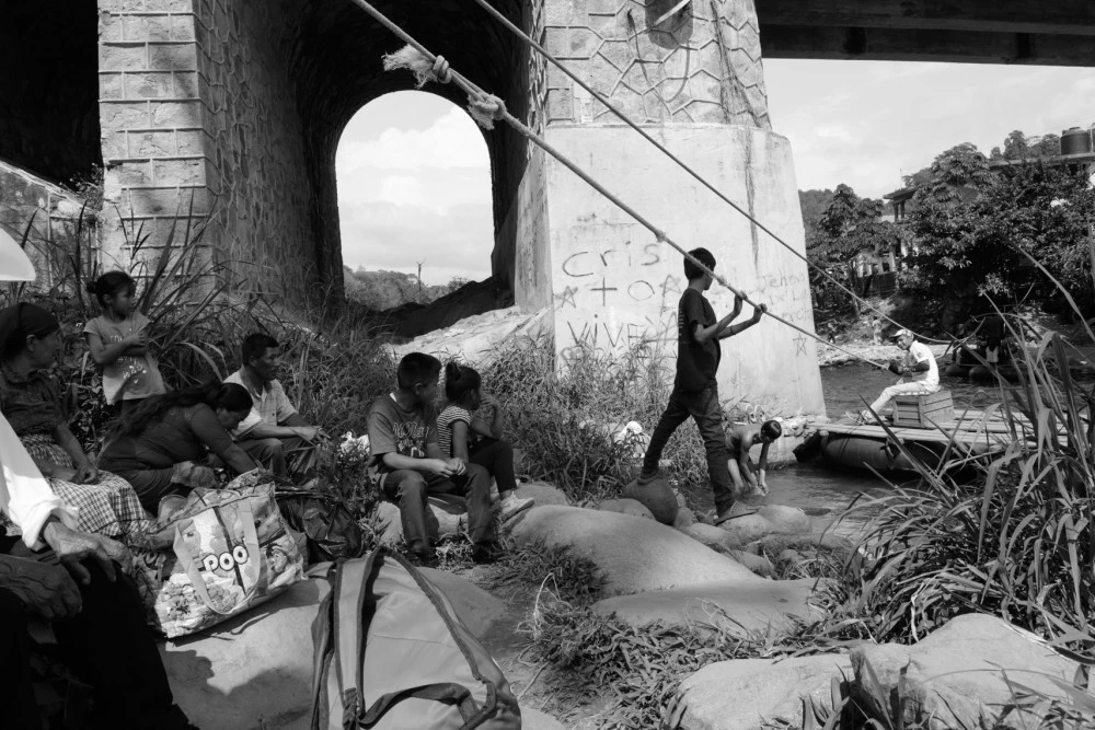 People illegally cross the Suchiate River that marks the Mexico/Guatemala border below the bridge that holds the official crossing. There is little immigration enforcement and people cross openly to migrate and buy and sell goods.