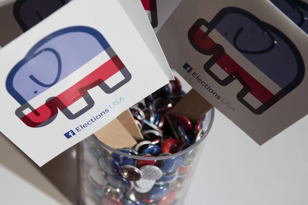 FaceBook Elections signs stand in the media area at Quicken Loans Arena in Cleveland, Thursday, Aug. 6, 2015, before the first Republican presidential debate. (AP Photo/John Minchillo)