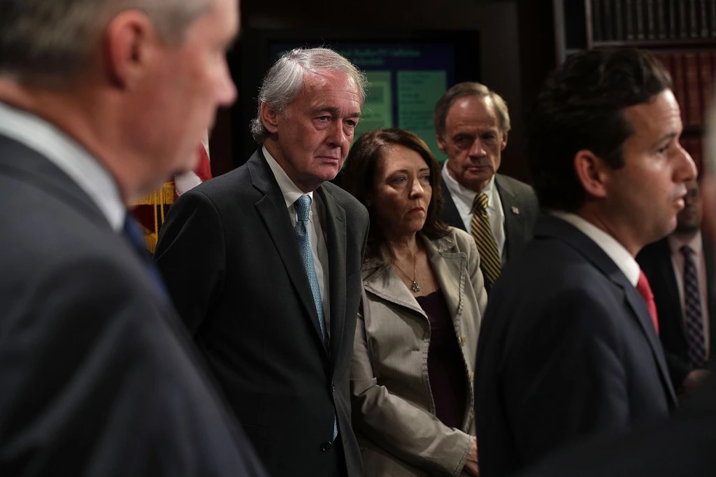 WASHINGTON, DC - MAY 24:  U.S. Sen. Brian Schatz (D-HI) (R) speaks as (L- 2nd R) Sen. Edward Markey (D-MA), Sen. Maria Cantwell (D-WA) and Sen. Tom Carper (D-DE) listen during a news conference at the Capitol May 24, 2017 in Washington, DC. Senate Democrats held a news conference to urge President Donald Trump to not withdraw from Paris Climate Agreement.  (Photo by Alex Wong/Getty Images)