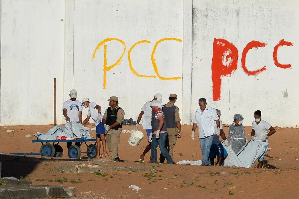 Corpses are dug out in the Alcacuz Penitentiary after a fight between rival gangs left at least 30 prisoners dead on the eve, near Natal, in the Brazilian northeastern state of Rio Grande do Norte, on January 15, 2017.The latest in a string of brutal prison massacres involving suspected gang members in Brazil is thought to have killed more than 30 people, including some who were beheaded, officials said Sunday. / AFP / ANDRESSA ANHOLETE (Photo credit should read ANDRESSA ANHOLETE/AFP/Getty Images)