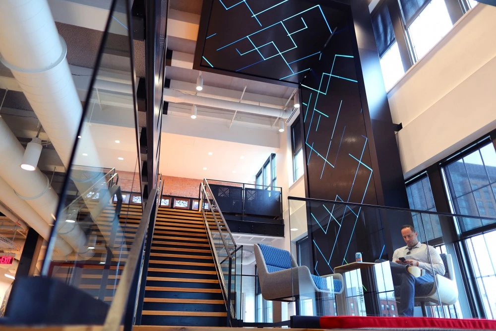 BOSTON, MA - JUNE 27: A staircase with video display is pictured at the new Red Hat computing and executive center in Fort Point in Boston on Jun. 27, 2017. (Photo by John Tlumacki/The Boston Globe via Getty Images)