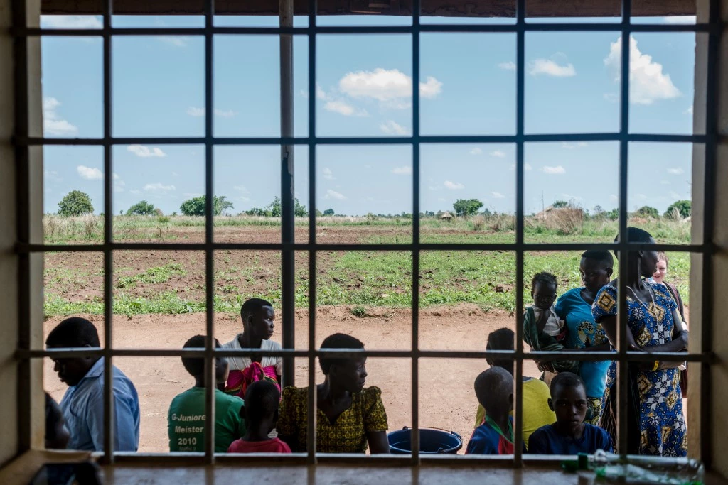 Women wait outside a local clinic to get family planning methods on March 26, 2018 in Parabongo, Uganda.