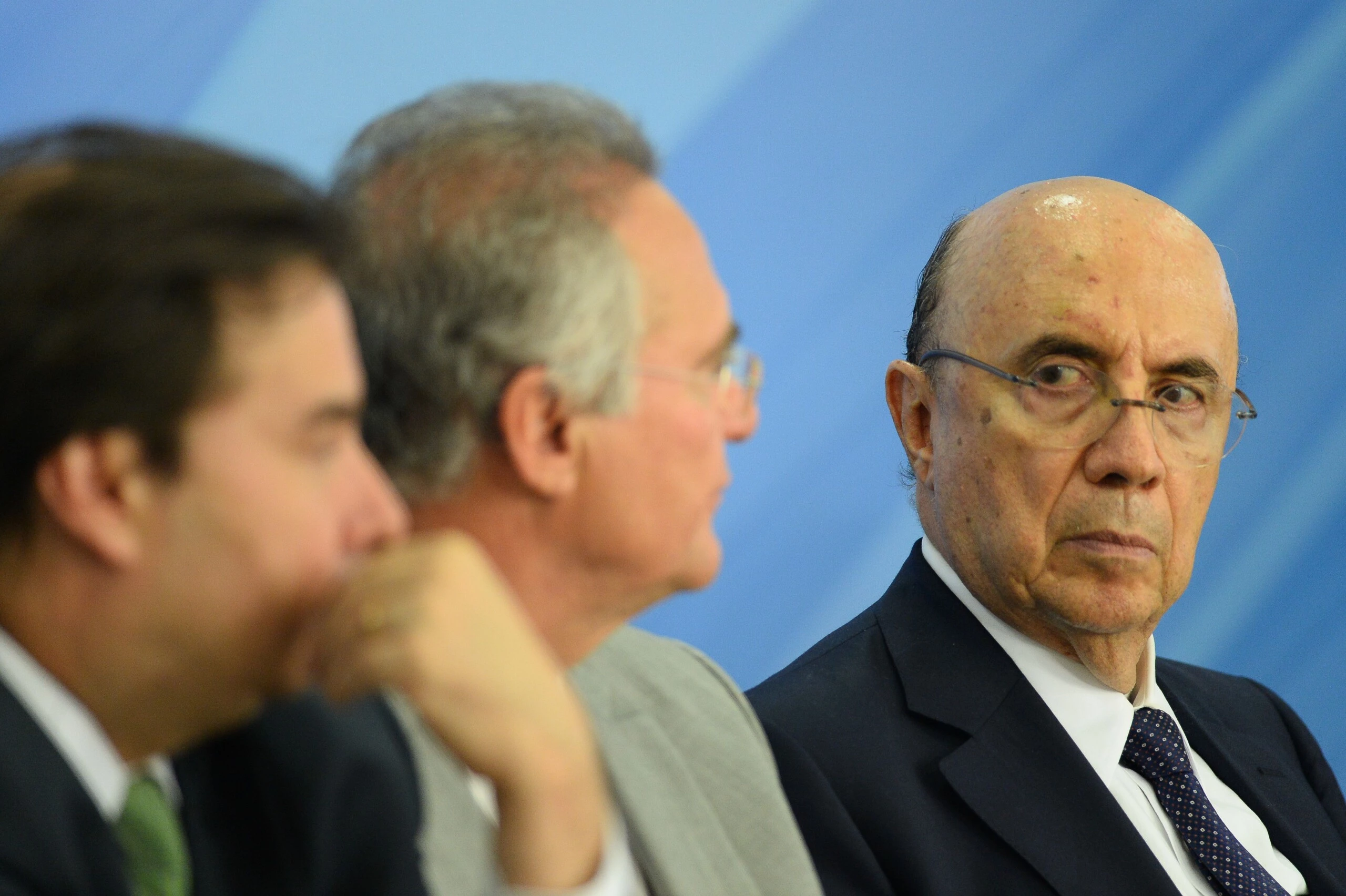 The president of Brazil's Chamber of Deputies Rodrigo Maia (L), the president of the Senate Renan Calheiros (C), and Finance Minister Henrique Meirelles (R) gesture during the announcement of new measures to stimulate the economy in the Planalto Palace on December 15, 2016 in Brasilia. / AFP / ANDRESSA ANHOLETE (Photo credit should read ANDRESSA ANHOLETE/AFP/Getty Images)