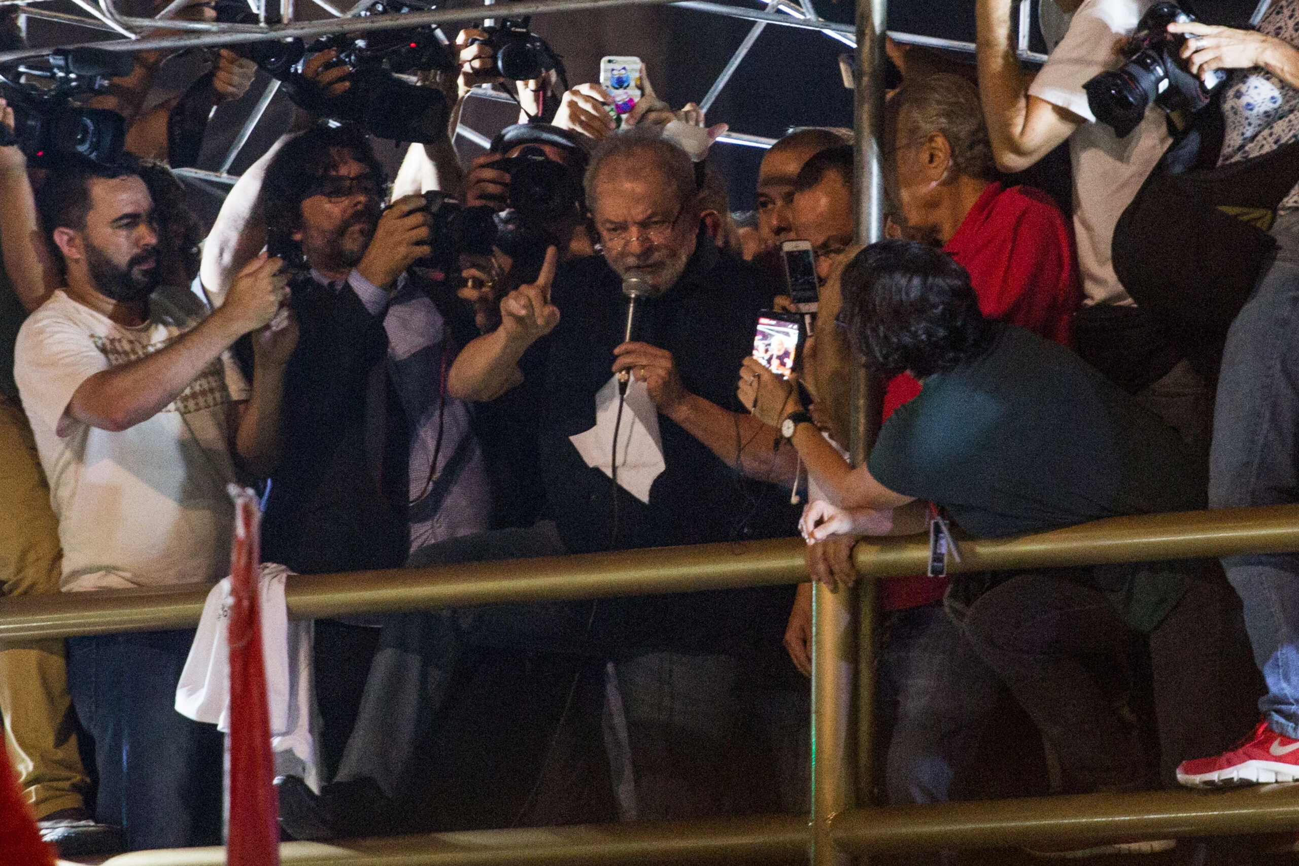 SAO PAULO, BRAZIL - MARCH 15: Former President Luiz Inacio Lula da Silva speaks during a protest against the pension reform proposed by President Michel Temer's government on March 15, 2017 in Sao Paulo, Brazil. Thousands of teachers, drivers from the transport system, bankers and various unions gathered on Avenida Paulista during a nationwide strike to protest the increase in time people must work before retirement. (Photo by Victor Moriyama/Getty Images)