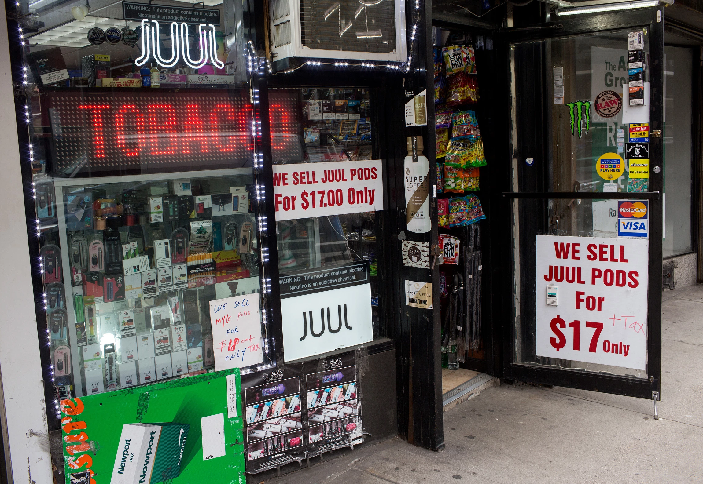 NEW YORK, NEW YORK - JANUARY 27: A tobacco store advertises and sells Juul tobacco products as vaping remains popular despite health warnings, on January 27, 2020 in midtown Manhattan, New York City. (Photo by Andrew Lichtenstein/Corbis via Getty Images)