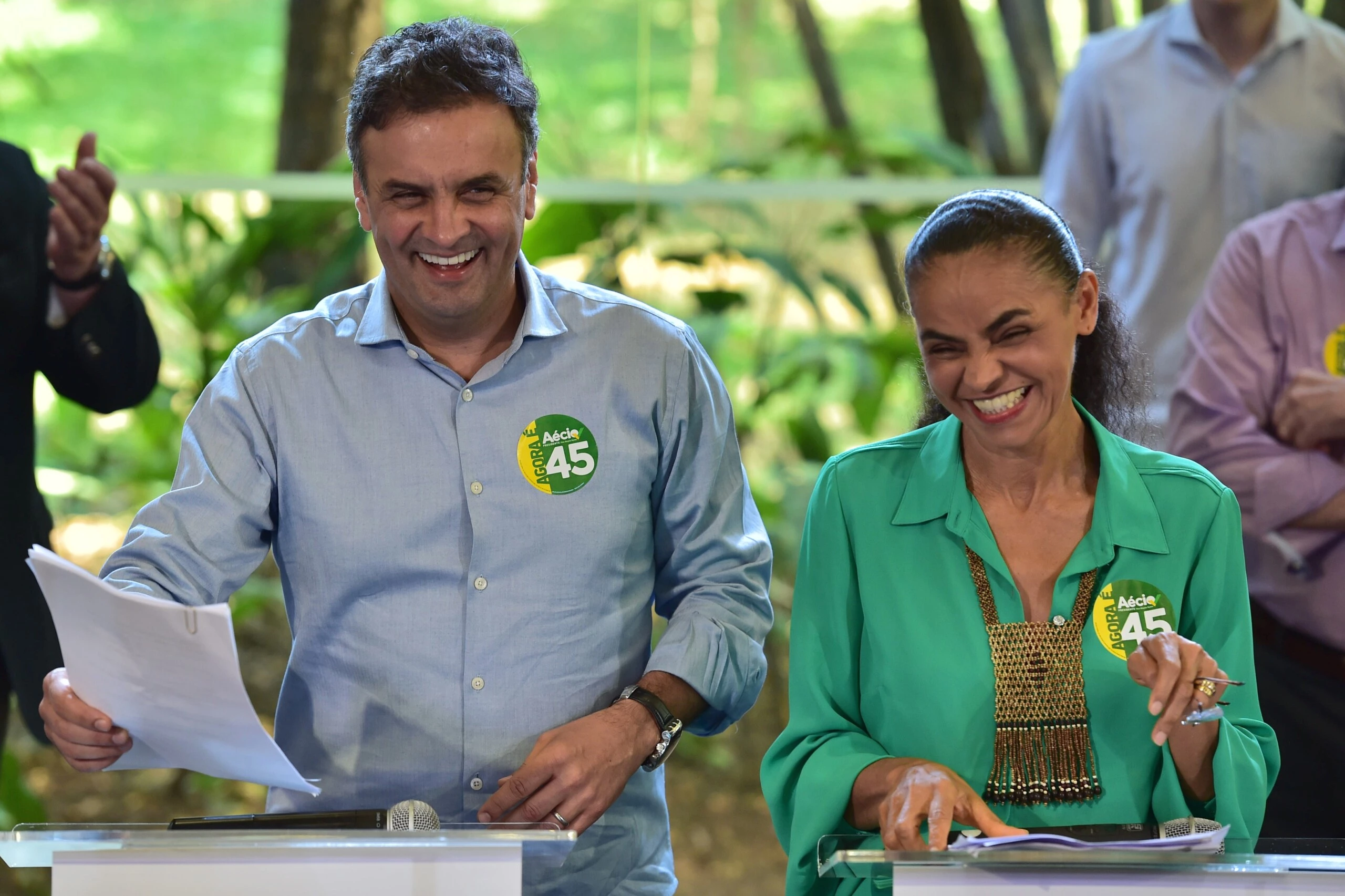 Brazil's presidential candidate for the Brazilian Social Democratic Party (PSDB), Aecio Neves (L), and former presidential candidate for the Brazilian Socialist Party's (PSB), Marina Silva, attend a campaign meeting in Sao Paulo on October 17, 2014. Neves lost to Brazilian President Dilma Rousseff in the first round almost two weeks ago, but opinion polls now show him in a statistical dead heat with her ahead of the October 26 run-off -- making Silva's backing vital. AFP PHOTO / NELSON ALMEIDA        (Photo credit should read NELSON ALMEIDA/AFP/Getty Images)