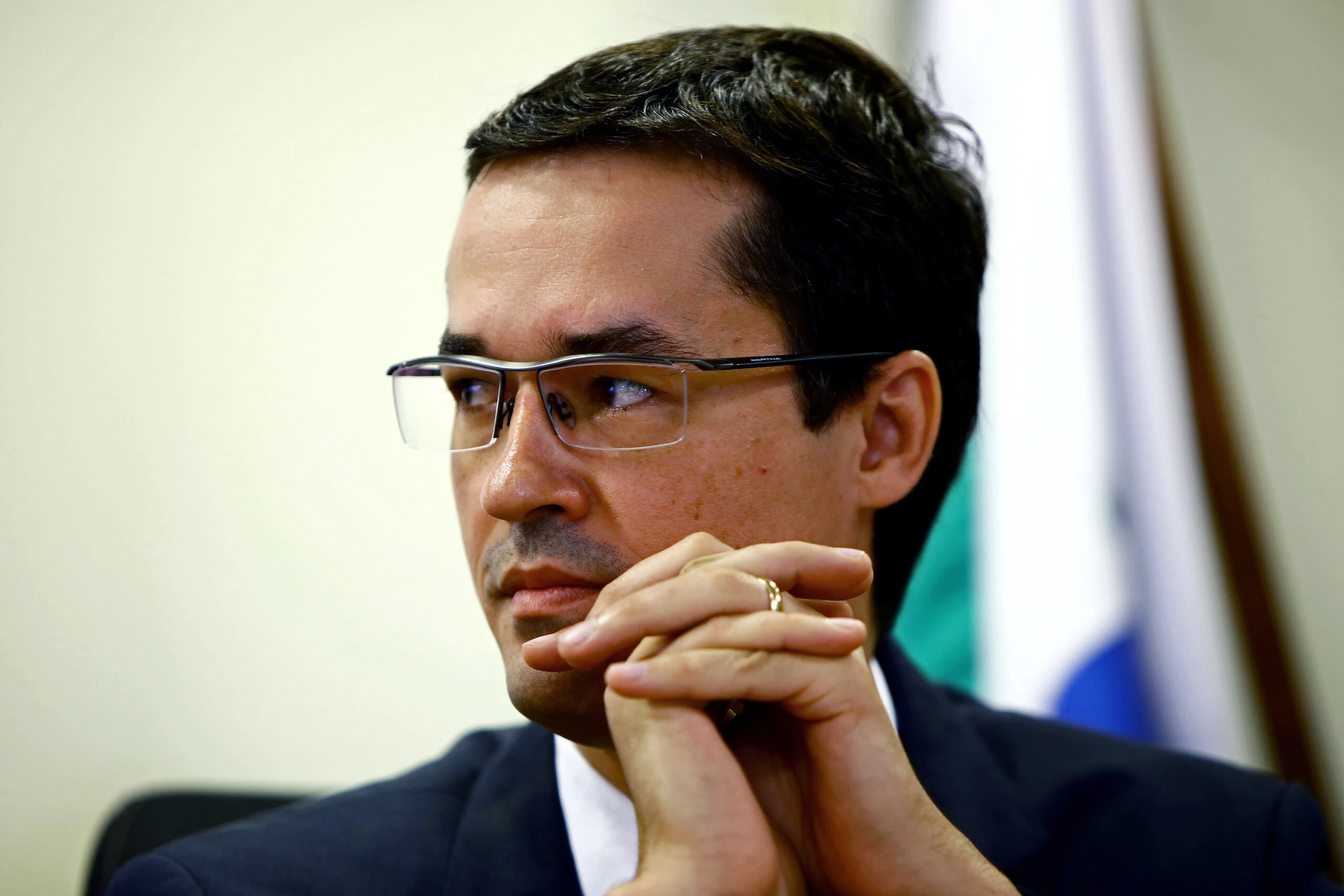 Brazilian Federal Attorney Deltan Dallagnol listens, during the ceremony for the return of resources to Petrobras, which were recovered through cooperation and leniency agreements in connection with Lava Jato operation, in Curitiba, Brazil on December 07, 2017. Petrobras received 654 million reais (200 million dollars) from legal agreements related to Lava Jato operation, the largest corruption investigation in Brazil's history, the state-owned company reported. / AFP PHOTO / Heuler Andrey (Photo credit should read HEULER ANDREY/AFP/Getty Images)