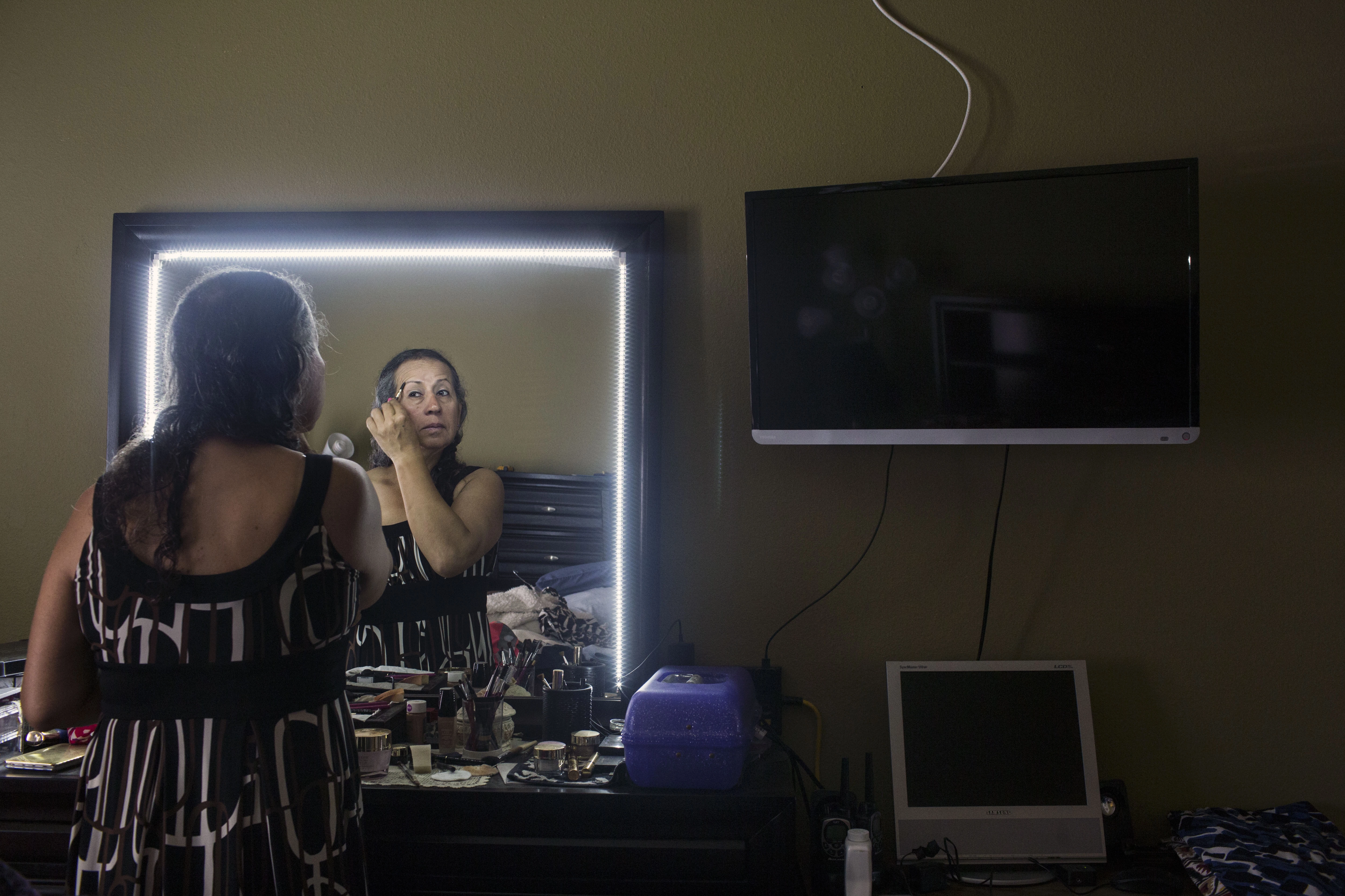 Former Uber driver, Rachel Galindo gets ready for the day in her home on April 30, 2017, in Los Angeles, California. As a transgender person, Galindo says she faced a lot of discrimination while driving for the company.
