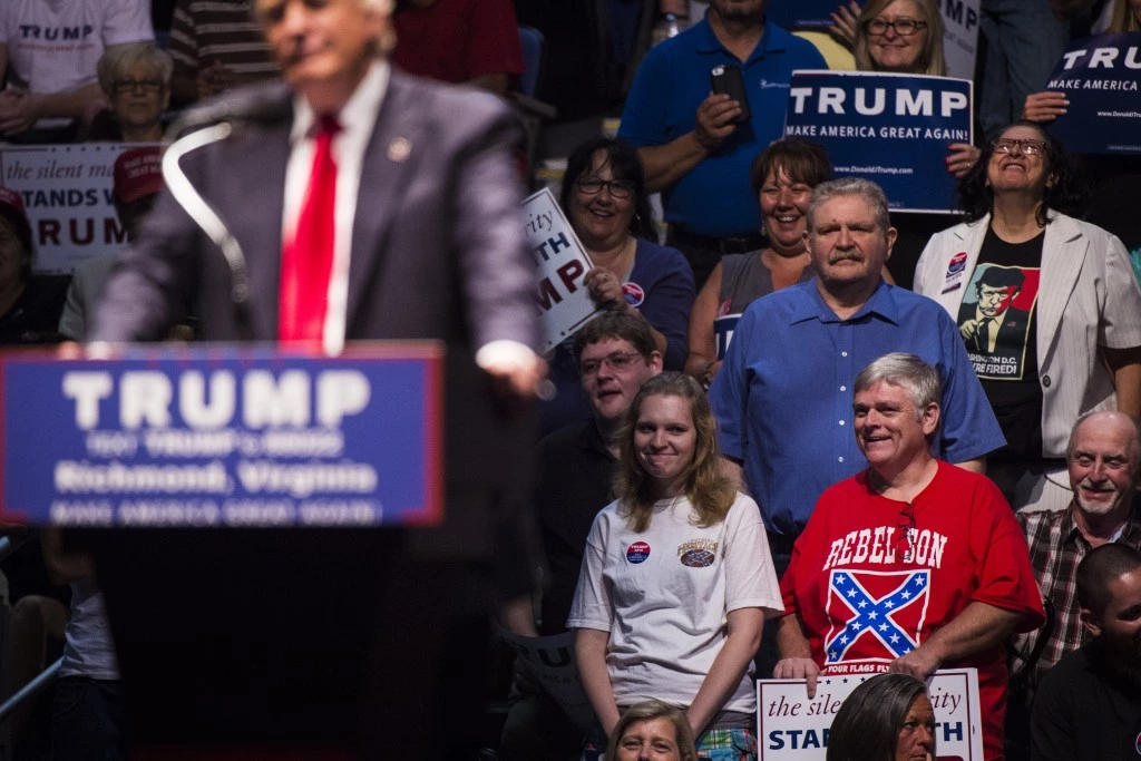 RICHMOND, VA - JUNE 10: A man wears a shirt with a confederate flag on it as Republican Presidential candidate Donald Trump speaks during a rally at the Richmond Coliseum in Richmond, VA on Friday June 10, 2016. (Photo by Jabin Botsford/The Washington Post via Getty Images)