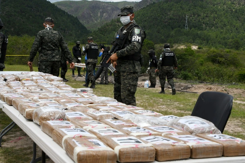 Authorities incinerate a load of cocaine seized to two Colombian nationals navigating along the Caribbean, in Tegucigalpa, on July 11, 2017. / AFP PHOTO / ORLANDO SIERRA        (Photo credit should read ORLANDO SIERRA/AFP/Getty Images)