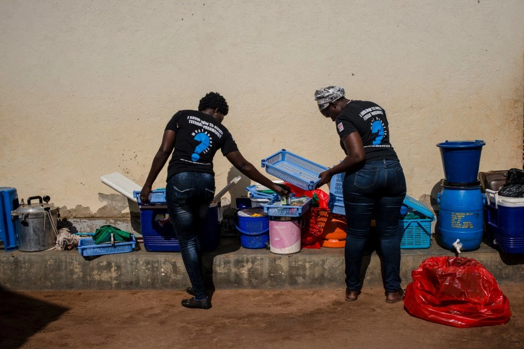 Marie Stopes health workers unload family planning supplies on March 26, 2018 in Parabongo, Uganda.
