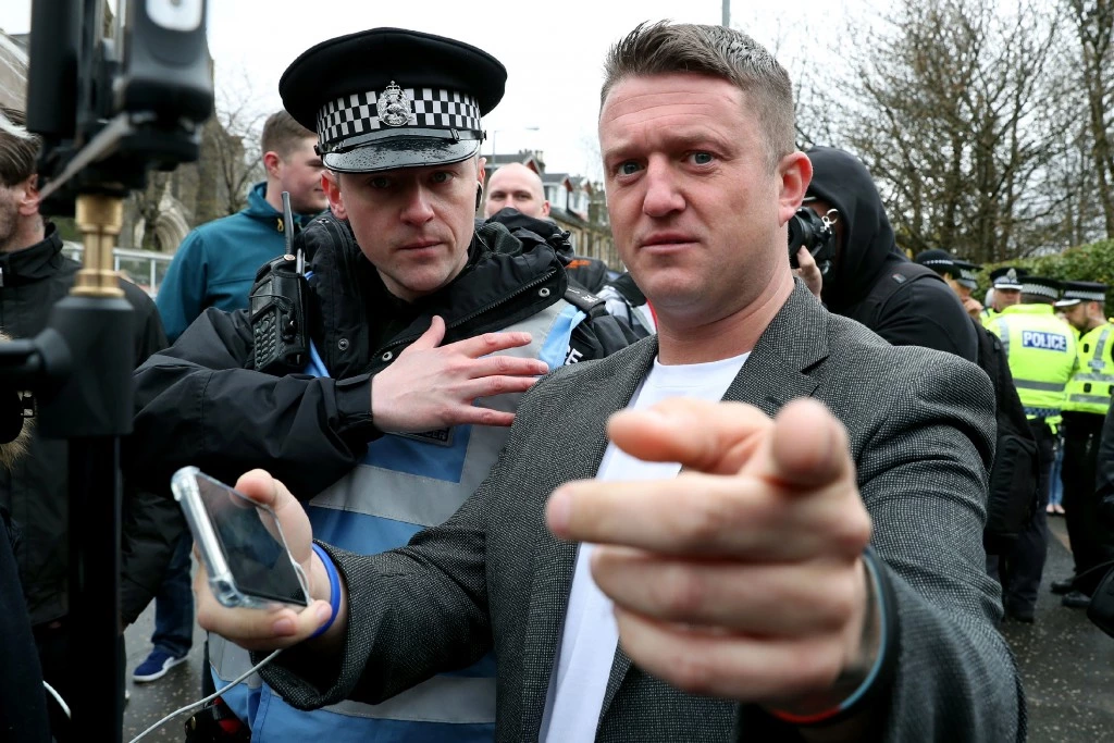 Mark Meechan court case. Former English Defence League leader Tommy Robinson outside Airdrie Sheriff Court after Mark Meechan was fined £800 for an offence under the Communications Act for posting a YouTube video of a dog giving Nazi salutes. Picture date: Monday April 23, 2018. See PA story COURTS Dog. Photo credit should read: Andrew Milligan/PA Wire URN:36143385