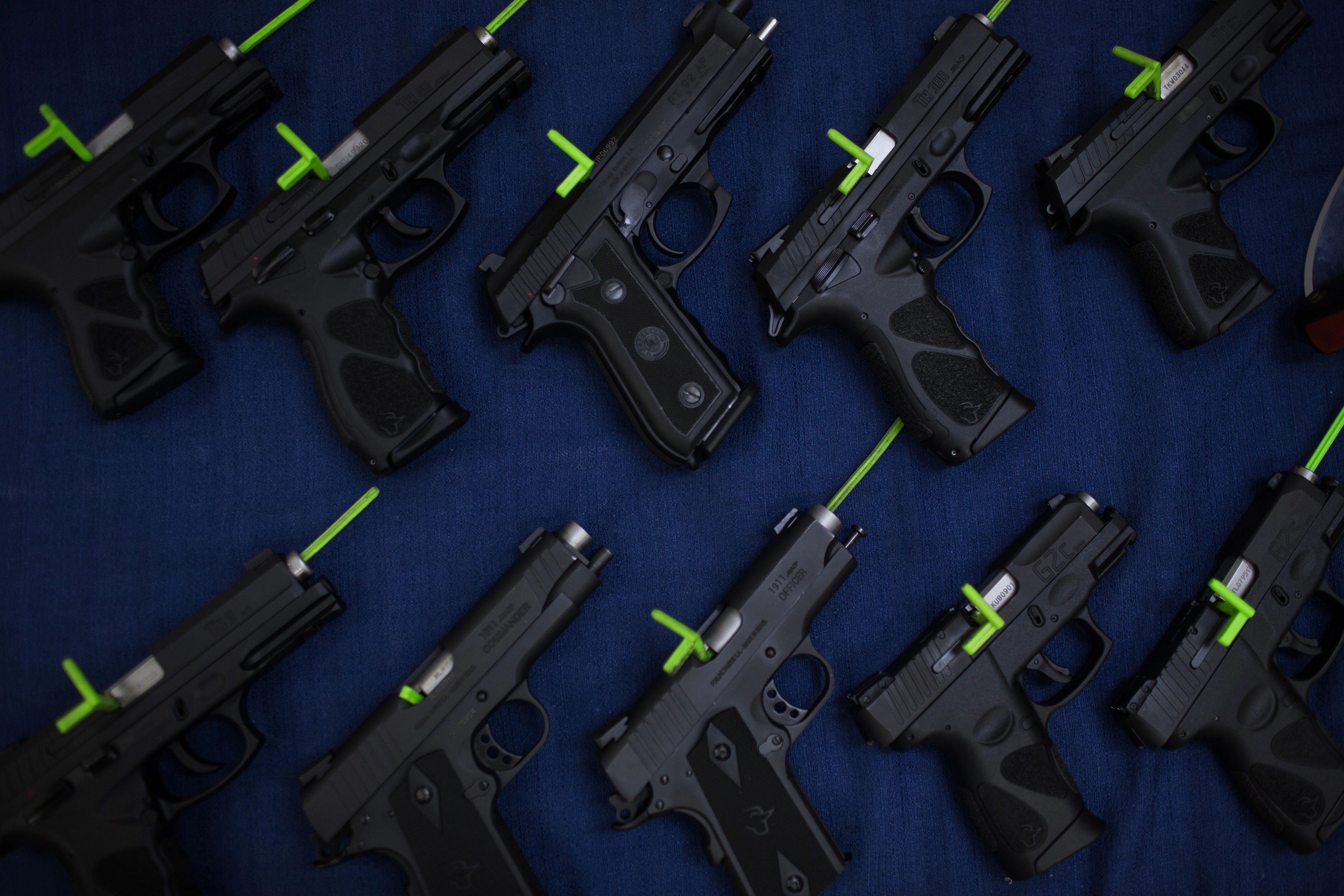 Handguns sit at the Forjas Taurus SA manufacturing facility in Sao Leopoldo, Brazil, on Tuesday, Feb. 5, 2019. Last month, Brazil's President Jair Bolsonaro signed a decree loosening the country's restrictive gun regulations, and hinted at further measures to arm law-abiding citizens to combat rampant crime. Photographer: Victor Moriyama/Bloomberg via Getty Images