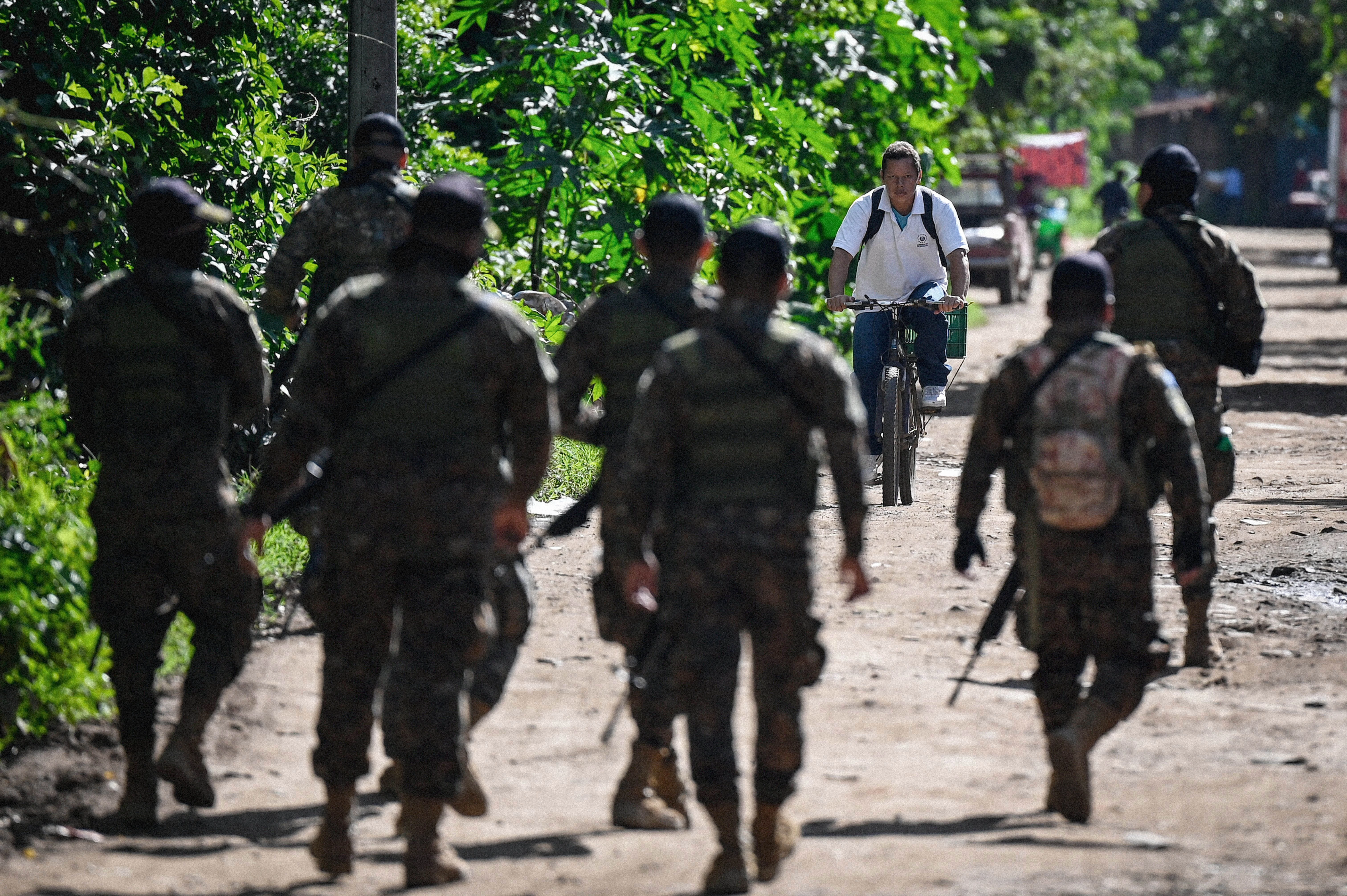 Soldiers search for gang members during the state of emergency declared by the Salvadoran government, in Santa Ana, El Salvador, on June 30, 2022. - In response to a spate of 87 murders committed between 25 and 27 March, Congress granted a request by President Nayib Bukele to decree a state of emergency, which has been extended until at least the end of July, and has allowed more than 43,000 suspected gang members to be detained without warrants. Organisations such as Amnesty International and the NGO Human Rights Watch have questioned the procedures and called on Bukele to respect human rights. The US government has also expressed concern about "arbitrary" detentions and "deaths in custody". (Photo by MARVIN RECINOS / AFP) (Photo by MARVIN RECINOS/AFP via Getty Images)