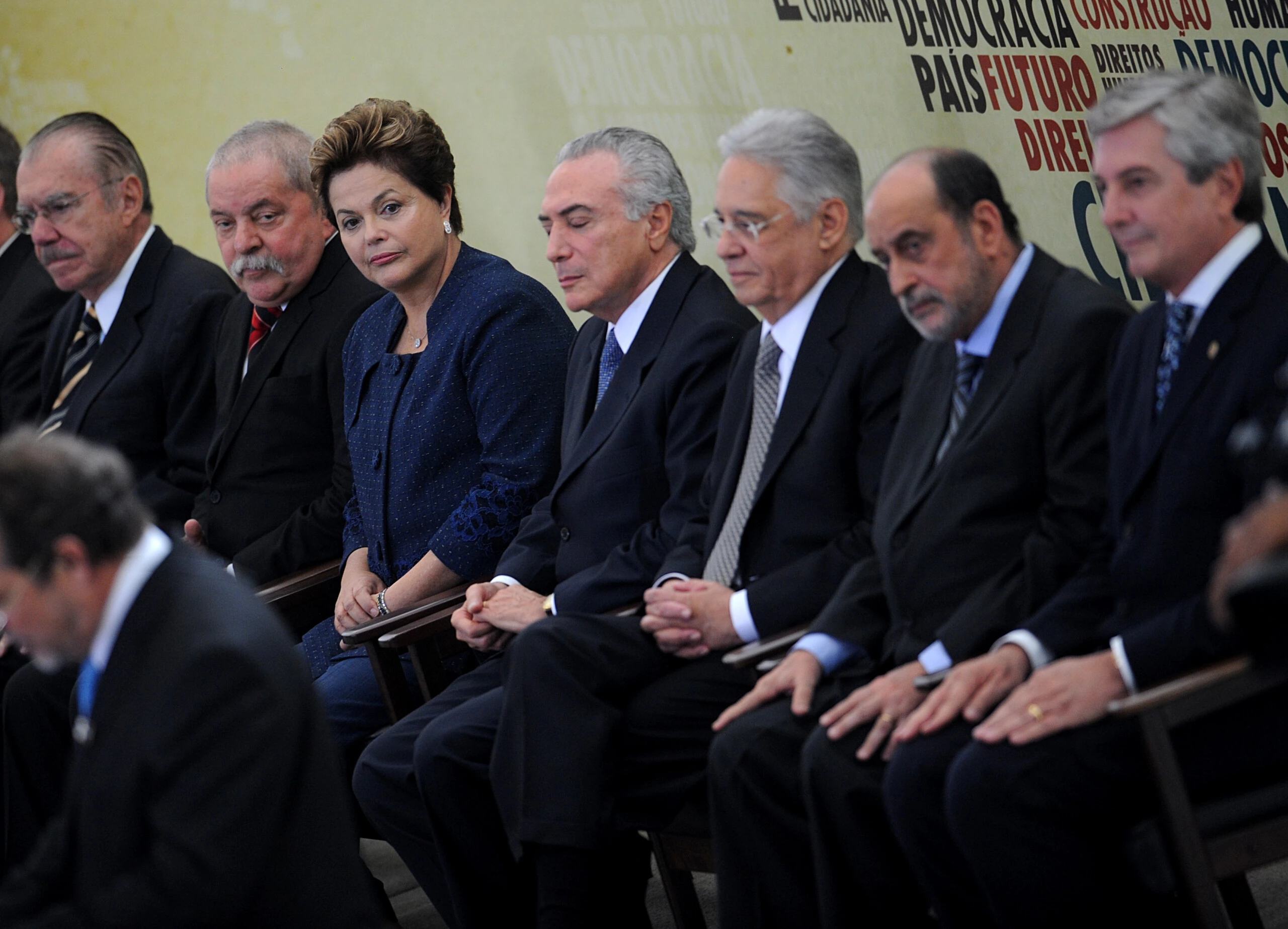 Brazilian President Dilma Rousseff (3-L) takes her seat during the inauguration ceremony of the National Commission of Truth that will investigate crimes and human rights violations committed during the Brazilian military dictatorship (1964-1984), at Planalto Palace, in Brasilia, on May 16, 2012. Also attending the ceremony Brazilian former presidents Jose Sarney (L), Luiz Inacio Lula da Silva (2-L), Fernando Henrique Cardoso (3-R) and Fernando Collor (R), and Vice-President Michel Temer (C) and the coordinator of the Commission Gilson Dipp (2-R).  AFP PHOTO/Pedro LADEIRA        (Photo credit should read PEDRO LADEIRA/AFP/GettyImages)