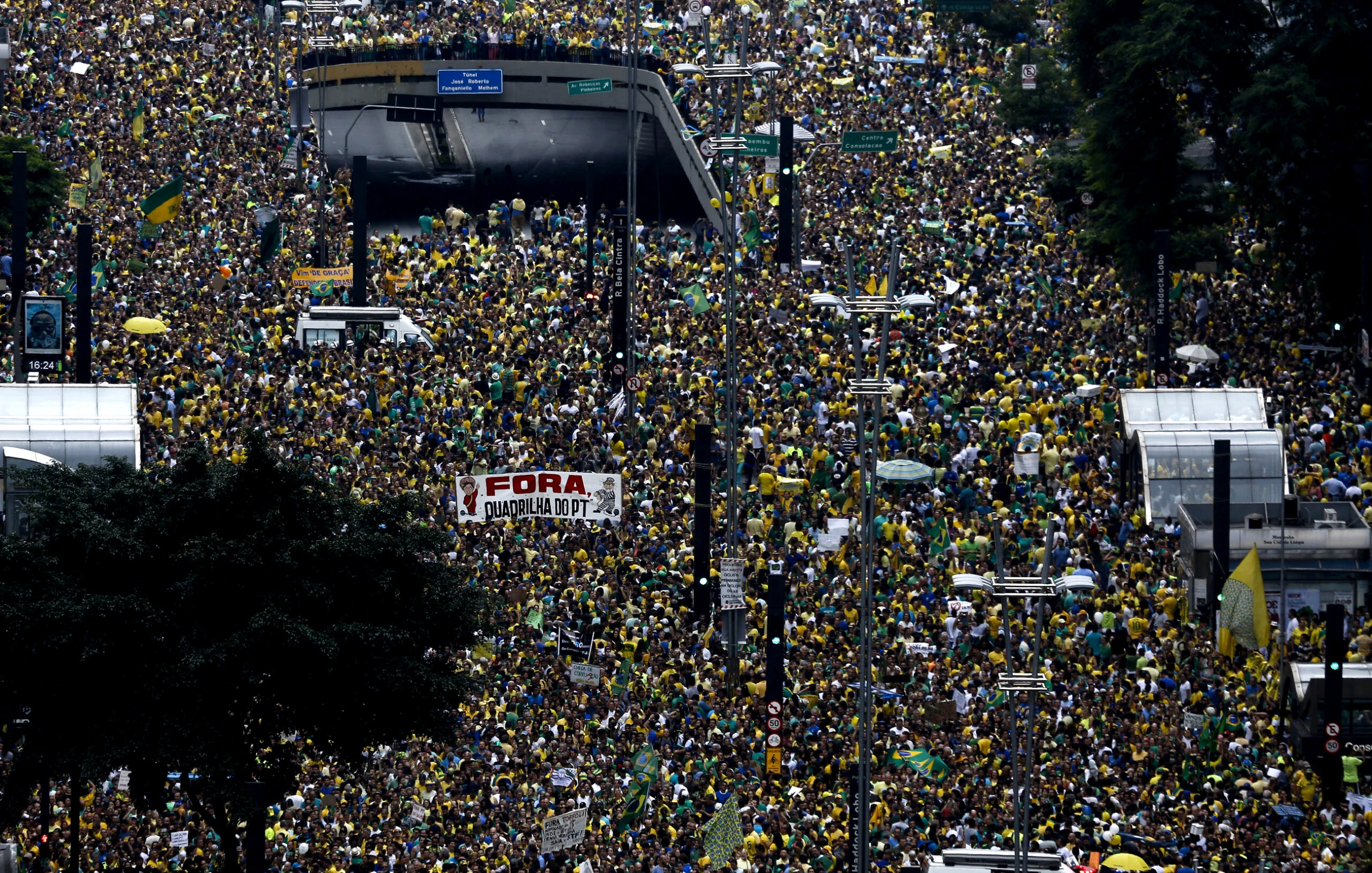 Thousands of demonstrators rally in support of the impeachment of Brazilian President Dilma Rousseff at Paulista Avenue in Sao Paulo, Brazil on March 13, 2016. Thousands of demonstrators clad in the yellow and green national flag's colors protested Sunday in several cities of Brazil to demand Rousseff's removal from office. AFP PHOTO-Miguel SCHINCARIOL / AFP / Miguel Schincariol        (Photo credit should read MIGUEL SCHINCARIOL/AFP/Getty Images)