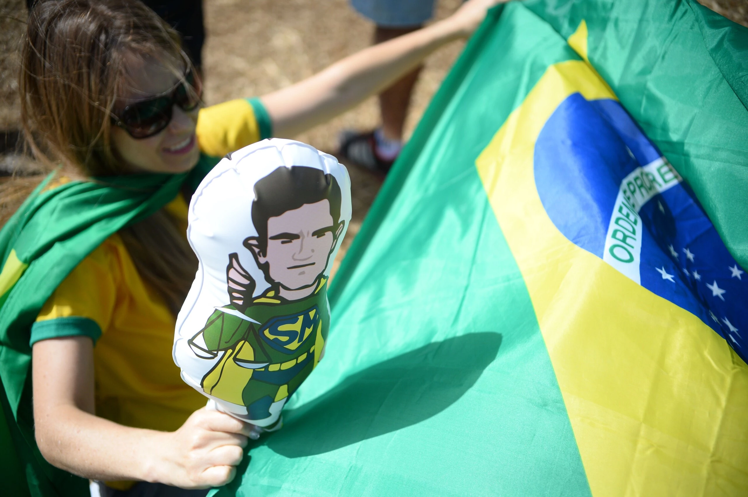 A woman holds an inflatable balloon depicting Brazilian judge Sergio Moro as a superhero, during a protest against suspended president Dilma Rousseff outside the National Congress in Brasilia, on July 31, 2016.Protesters took to the streets of Brazil on Sunday to demand the final leaving of suspended President Dilma Rousseff or to defend her continuance, just five days before the start of the Rio 2016 Olympic Games. / AFP / ANDRESSA ANHOLETE        (Photo credit should read ANDRESSA ANHOLETE/AFP/Getty Images)