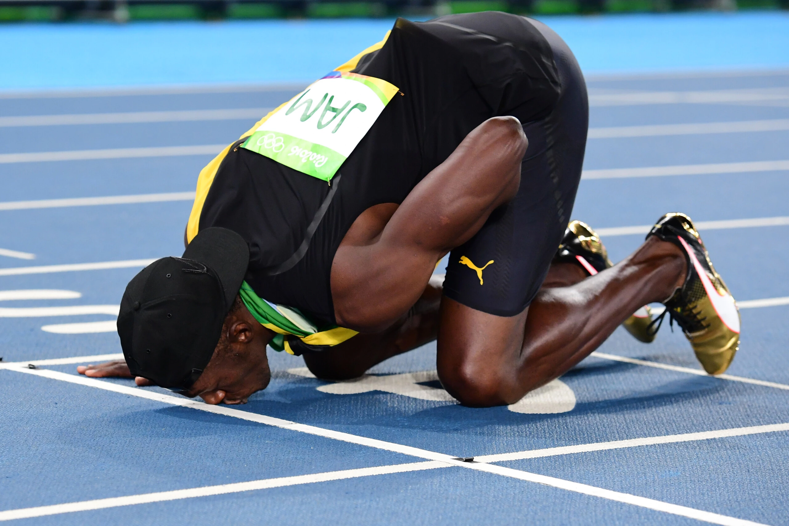 Jamaica's Usain Bolt kisses the track as he celebrates Team Jamaica winning the Men's 4x100m Relay Final during the athletics event at the Rio 2016 Olympic Games at the Olympic Stadium in Rio de Janeiro on August 19, 2016.   / AFP / FRANCK FIFE        (Photo credit should read FRANCK FIFE/AFP/Getty Images)