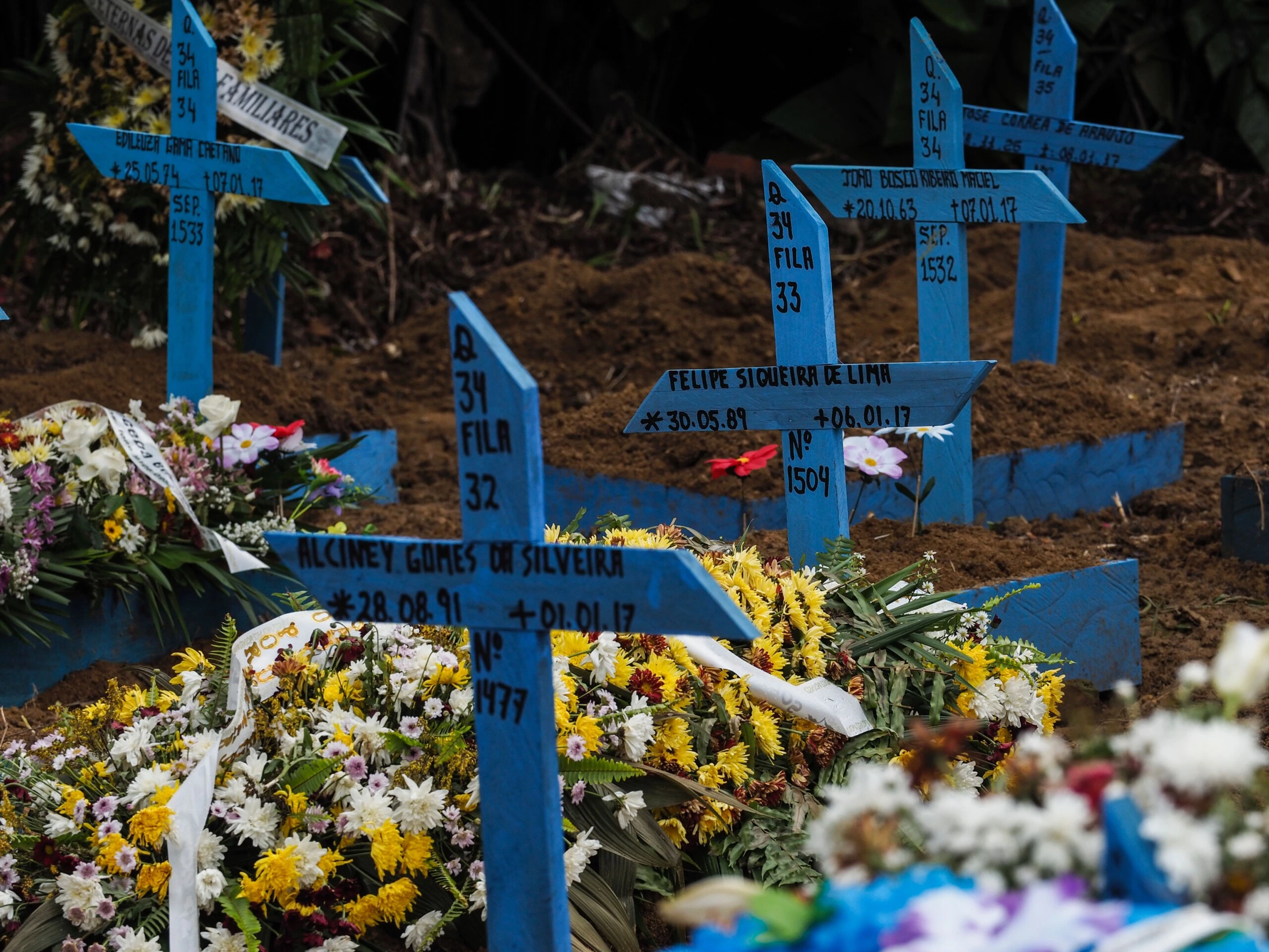 View of the graves at Nossa Senhora Aparecida Cemetery -also known as Taruma Cemetery- of the inmates killed in the recent riots in prisons, on January 9, 2017, in Manaus, Amazonas state, Brazil. At least four inmates were killed on the eve in a facility in Manaus, sending the number of violent prison fatalities over 100 in just one week. Prisons there -- and throughout Brazil -- are often under the de facto control of drug gangs, whose turf wars on the outside are also fought out among inmates. / AFP / RAPHAEL ALVES (Photo credit should read RAPHAEL ALVES/AFP/Getty Images)