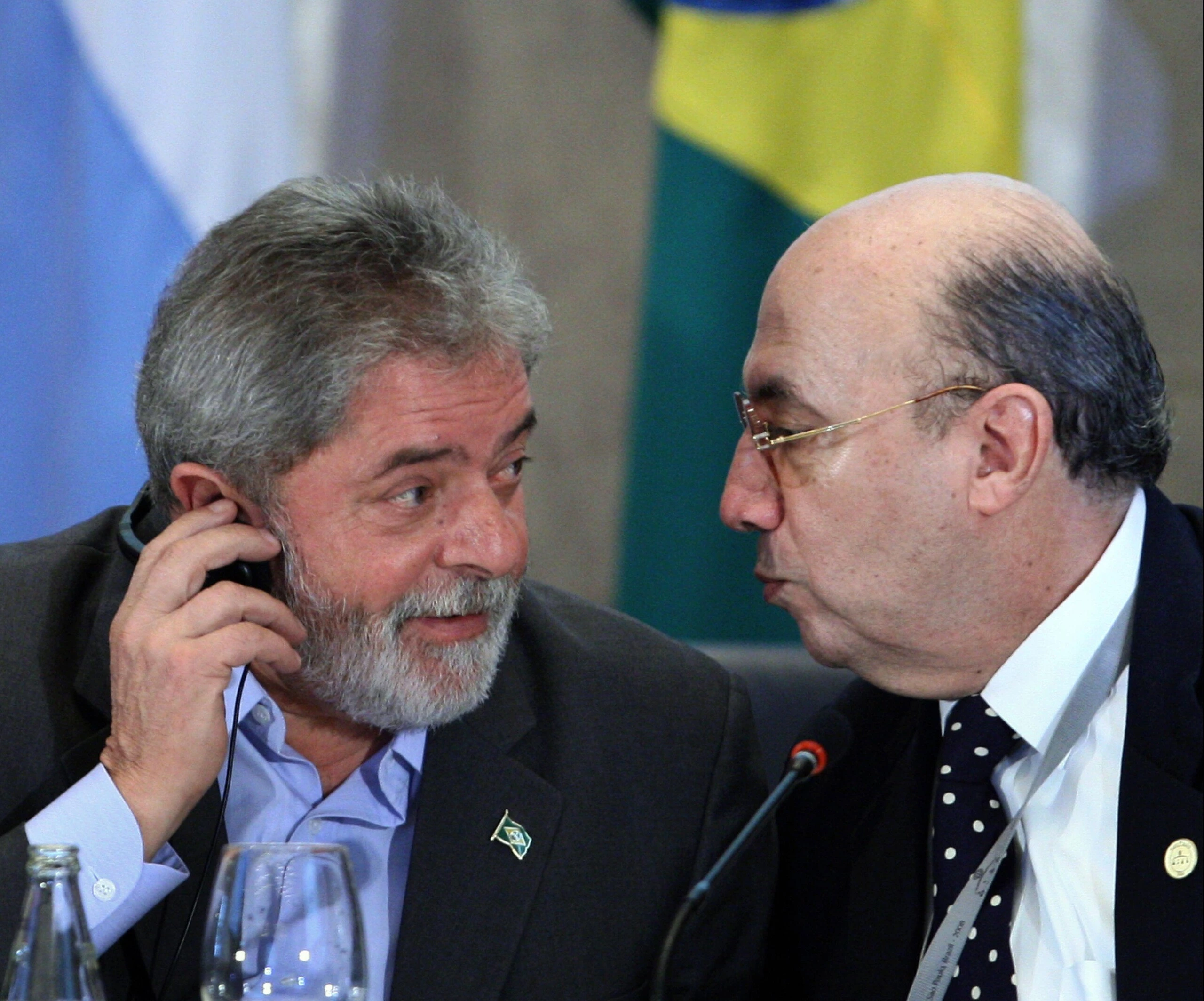 Brazil's President Luiz Inacio Lula da Silva (L) chats with Central Bank president Henrique Meirelles, during the opening of the G20 Ministers and Central Bank Governors' Meeting, in Sao Paulo, Brazil, on November 8, 2008. Looking to take the first steps toward revamping a global financial system ravaged by crisis, leaders from the main industrialized and emerging economies gather Saturday seeking common ground. European leaders have said they hope the Sao Paulo meeting will lay the groundwork for the start of key reforms to be put in motion starting with a November 15 summit in Washington of G20 leaders.  AFP PHOTO/Mauricio LIMA (Photo credit should read MAURICIO LIMA/AFP/Getty Images)