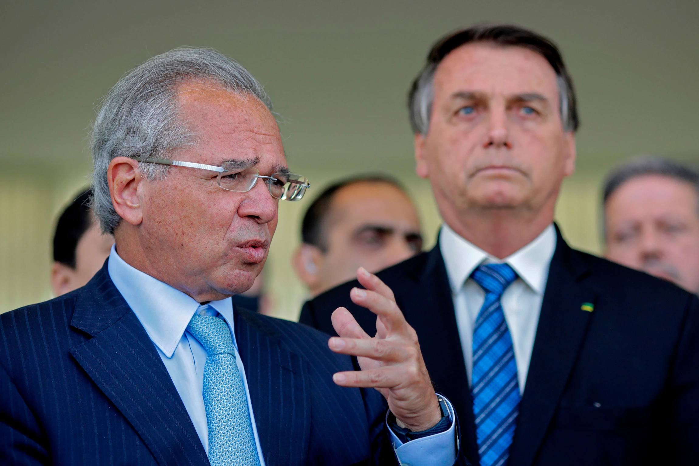 Brazilian Economy Minister Paulo Guedes (L) speaks next to Brazilian President Jair Bolsonaro (R) during a statement on financial aid for vulnerable Brazilians amid the COVID-19 pandemic, at Planalto Palace, in Brasilia, on September 1, 2020. - Brazil announced a reduction of 9.1% in the gross domestic product. (Photo by Sergio Lima / AFP) (Photo by SERGIO LIMA/AFP via Getty Images)