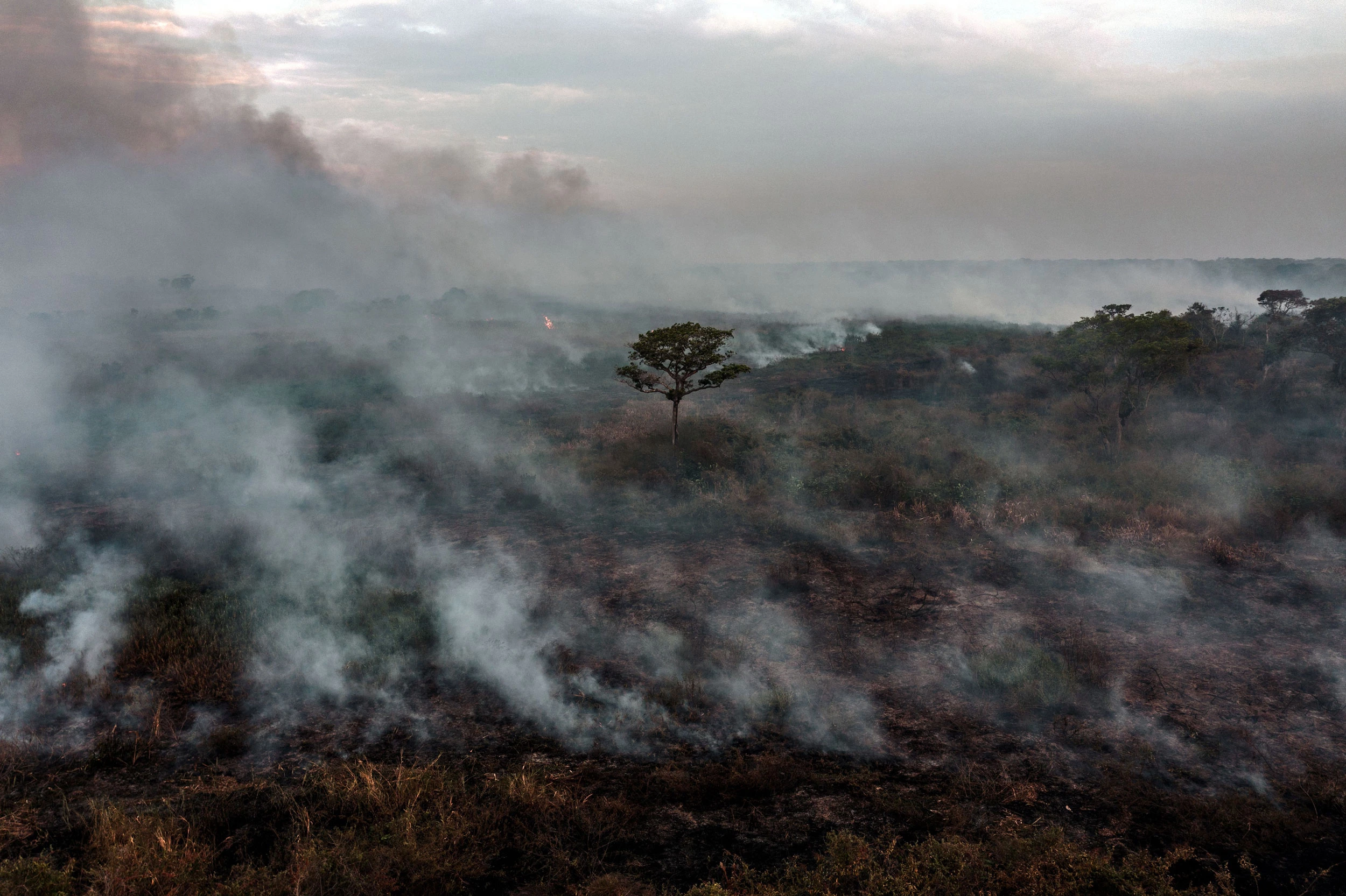 TOPSHOT - Aerial view of a forest fire in Porto Jofre, Pantanal, Mato Grosso state, Brazil, on September 5, 2021. - The Amazon basin has, until recently, absorbed large amounts of humankind's ballooning carbon emissions, helping stave off the nightmare of unchecked climate change. But studies indicate the rainforest is hurtling toward a "tipping point," at which it will dry up and turn to savannah, its 390 billion trees dying off en masse. Already, the destruction is quickening, especially since far-right President Jair Bolsonaro took office in 2019 in Brazil -- home to 60 percent of the Amazon -- with a push to open protected lands to agribusiness and mining. (Photo by CARL DE SOUZA / AFP) (Photo by CARL DE SOUZA/AFP via Getty Images)