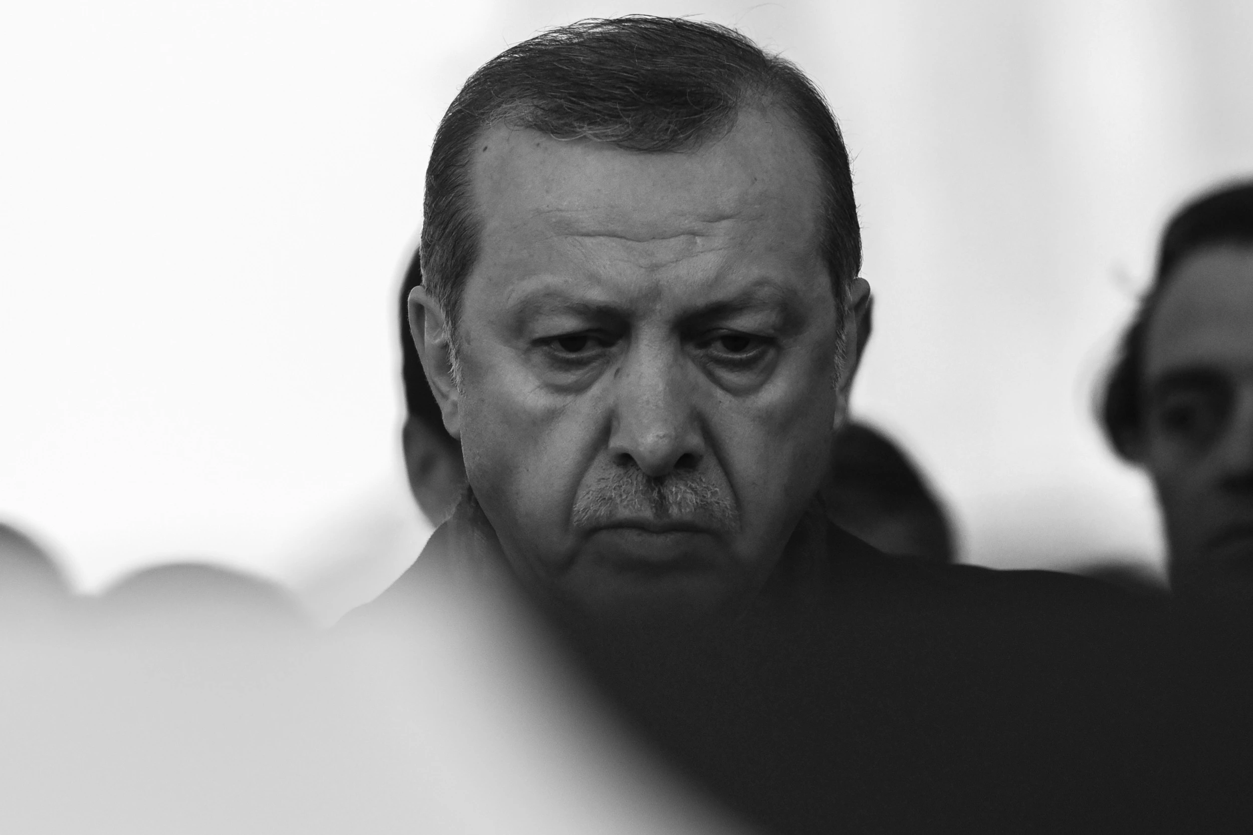 Turkish President Recep Tayyip Erdogan attends the funeral of Turkish police officer Hasim Usta, who was killed in the December 10 blasts outside Besiktas' Vodafone Arena football stadium, on December 12, 2016 in Istanbul. The death toll from the Istanbul twin bombings near the major football stadium has risen to 44, Turkish Health Minister Recep Akdag said on December 12. / AFP / OZAN KOSE (Photo credit should read OZAN KOSE/AFP via Getty Images)