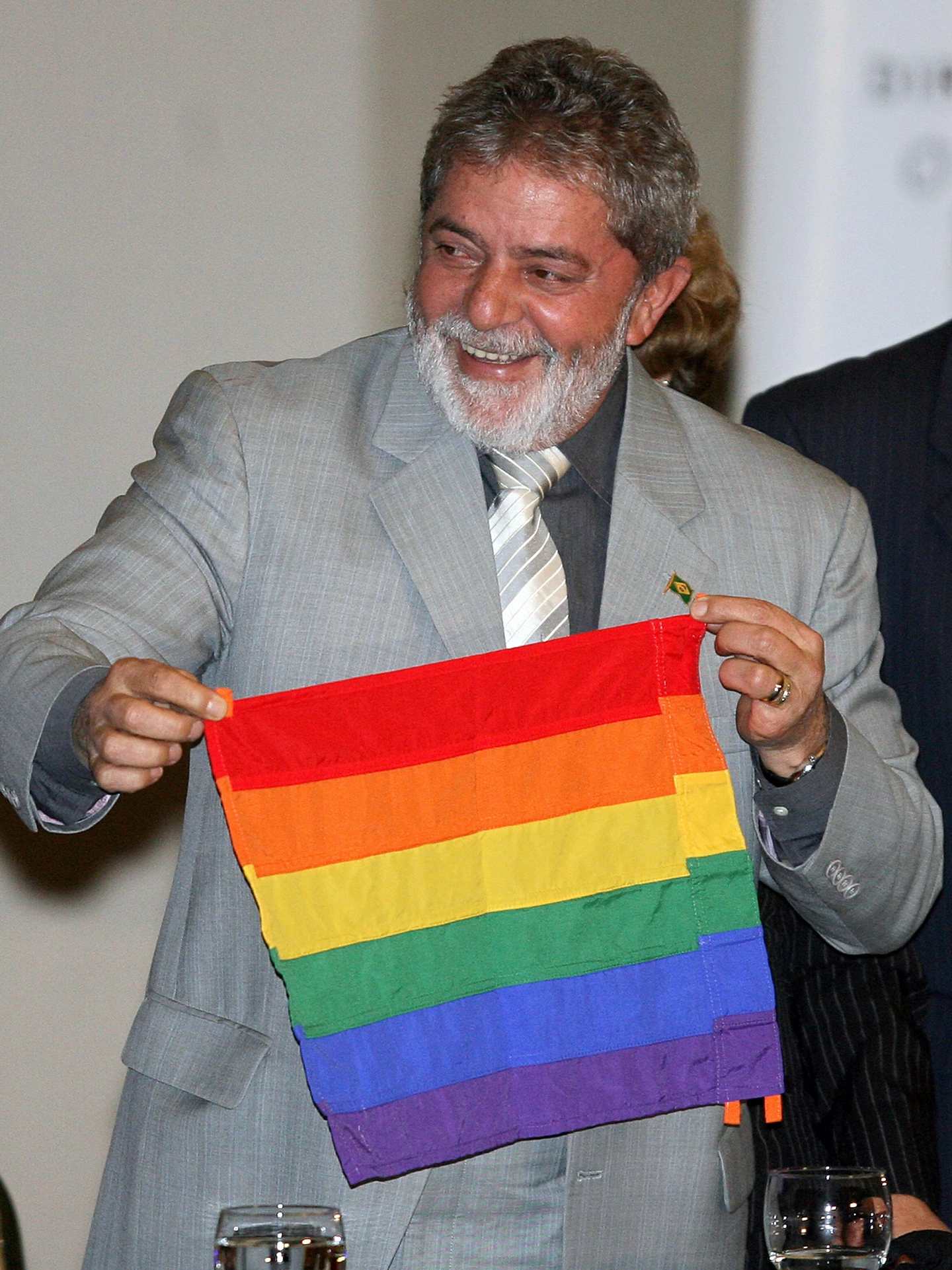 Brazilian President Luiz Inacio Lula da Silva holds a flag of the gay movement during the opening ceremony of the I National Conference of Gays, Lesbians and Transsexuals, on June 5, 2008, in Brasilia. AFP PHOTO/Joedson Alves (Photo credit should read JOEDSON ALVES/AFP/Getty Images)