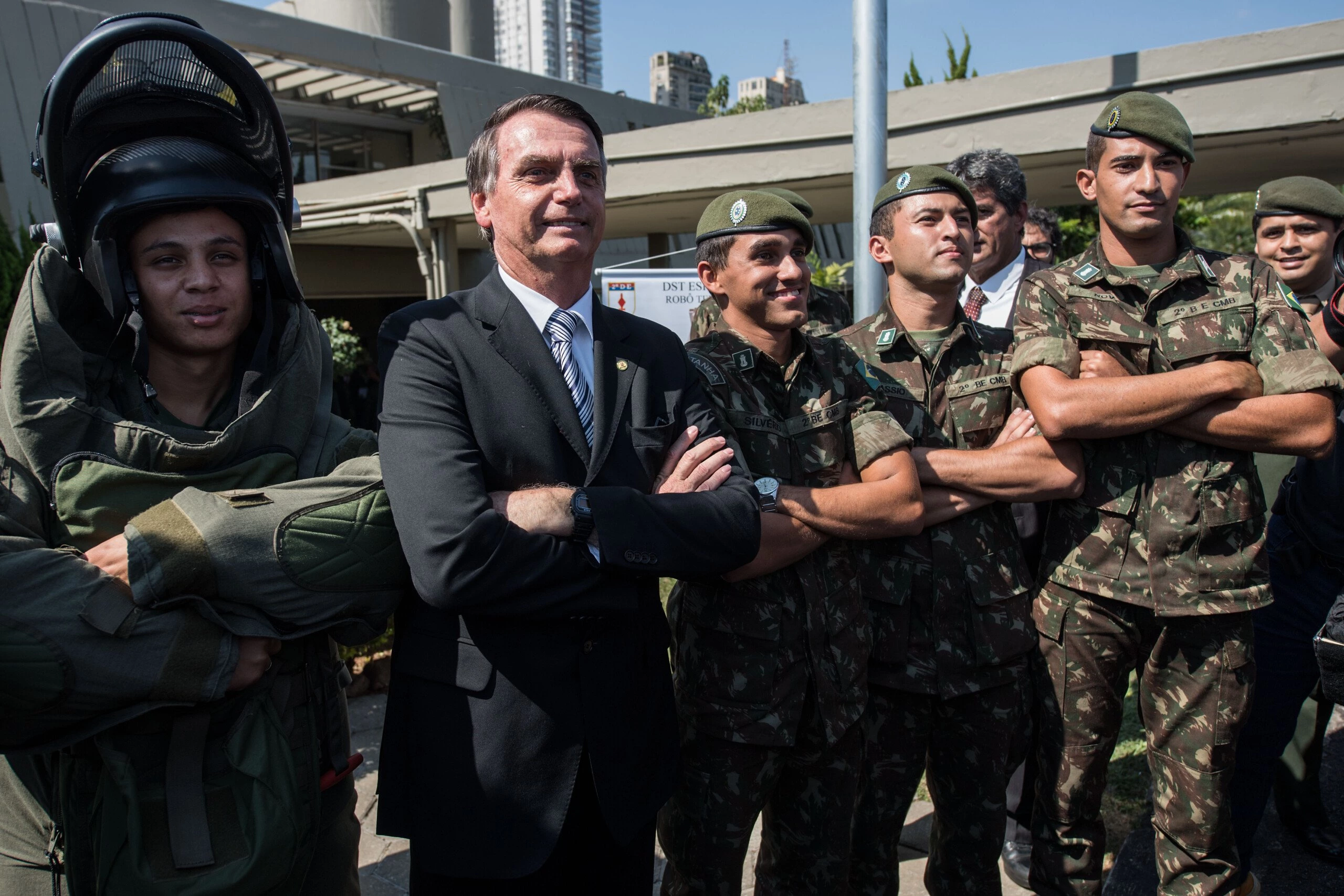 Brazilian congressman and presidential canditate for the next election, Jair Bolsonaro (R), poses for pictures with militaries during an military event in Sao Paulo, Brazil on May 3, 2018. (Photo by Nelson ALMEIDA / AFP)        (Photo credit should read NELSON ALMEIDA/AFP/Getty Images)
