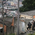 RIO DE JANEIRO, BRAZIL - MARCH 21:  Military Police (PM) conduct an operation in the 'pacified' Complexo do Alemao 'favela' community following a shootout earlier in the day on March 21, 2015 in Rio de Janeiro, Brazil.  The complex of favelas has suffered numerous shootouts recently. The government recently created a commission with the objective to increase social projects in communities such as Complexo do Alemao that have a Pacifying Police Unit (UPP). The new aim acknowledges that the communities, many of which remain plagued by violence and other issues, cannot solely be ?pacified? by police operations.  (Photo by Mario Tama/Getty Images)