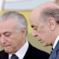 Brazilian acting President Michel Temer (L) and his Foreign Minister Jose Serra attend a ceremony of the presentation of credentials of Ambassadors at Planalto Palace in Brasilia on May 25, 2016. / AFP / EVARISTO SA        (Photo credit should read EVARISTO SA/AFP/Getty Images)
