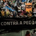 Opposers to President Michel Temer's economic recovery program, march against the constitutional amendment (PEC) 241, in Rio de Janeiro, Brazil, on October 17, 2016.Approved by Brazils lower house, the constitutional amendment limits budget increases to the rate of inflation for the next 20 years. Leftist lawmakers had fought against the spending cap, arguing that it would dramatically worsen conditions for ordinary Brazilians, especially the poor. / AFP / YASUYOSHI CHIBA (Photo credit should read YASUYOSHI CHIBA/AFP/Getty Images) Opposers to President Michel Temer's economic recovery program, march against the constitutional amendment (PEC) 241, in Rio de Janeiro, Brazil, on October 17, 2016.Approved by Brazils lower house, the constitutional amendment limits budget increases to the rate of inflation for the next 20 years. Leftist lawmakers had fought against the spending cap, arguing that it would dramatically worsen conditions for ordinary Brazilians, especially the poor. / AFP / YASUYOSHI CHIBA (Photo credit should read YASUYOSHI CHIBA/AFP/Getty Images)